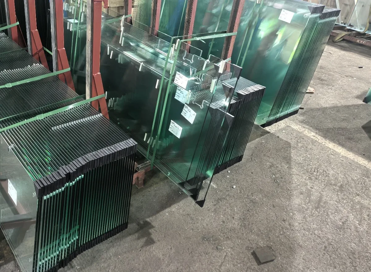Shower glass panels with shaped edges and fabrication details