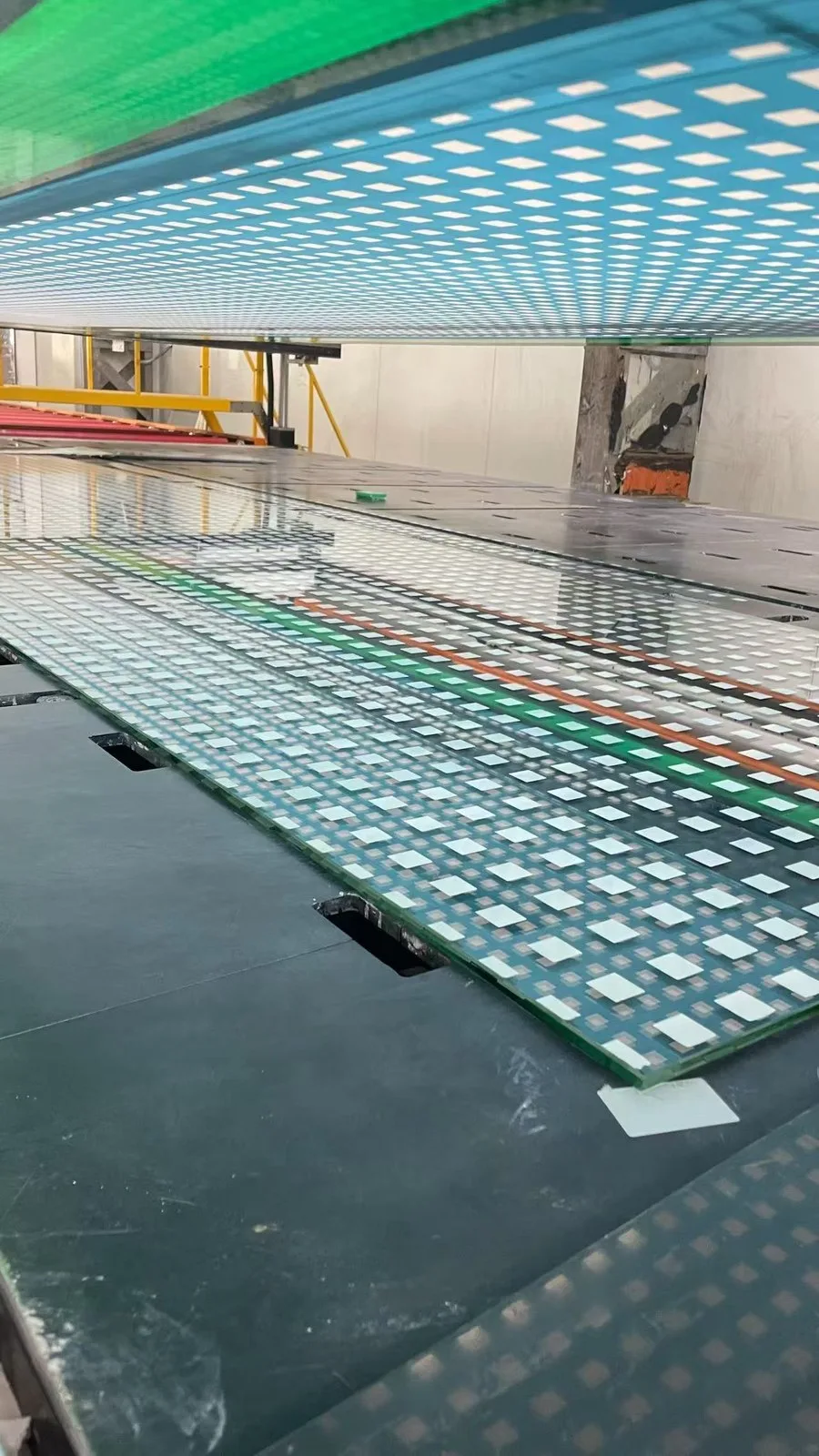 Patterned ceramic fritted glass panel on the production line