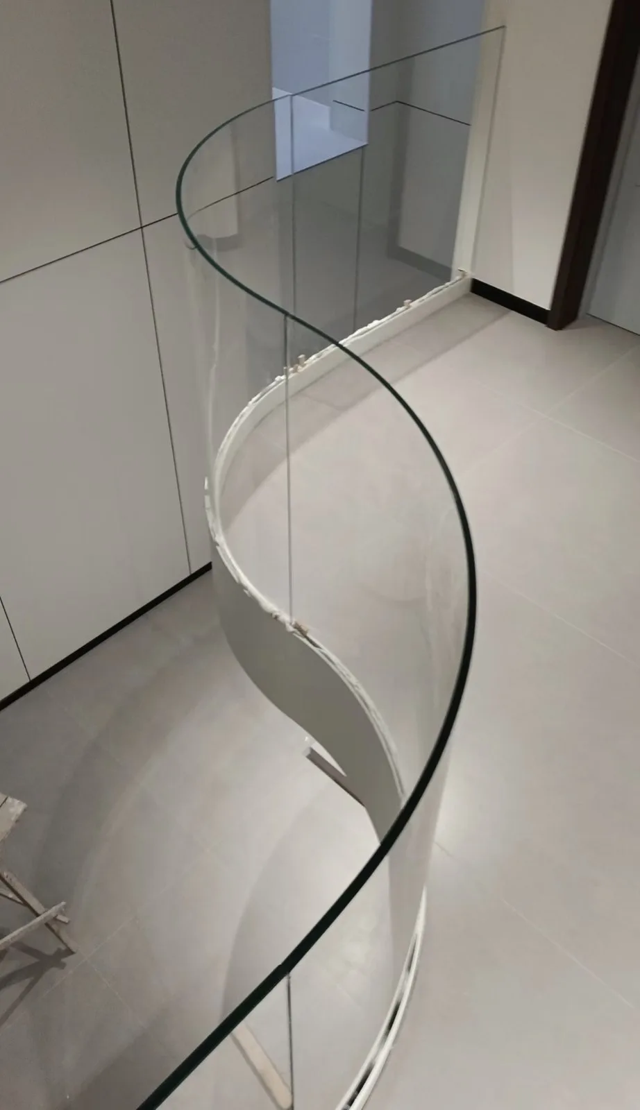 Curved glass panels in a stair railing reference